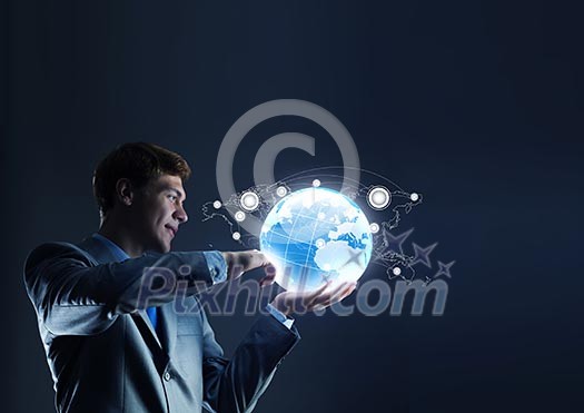 Businessman holding digital Earth planet in hand Businessman holding digital Earth planet in hand