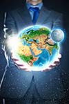 Young businessman holding Earth planet in palm. Elements of this image are furnished by NASA