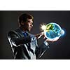 Young businessman holding Earth planet in palm. Elements of this image are furnished by NASA