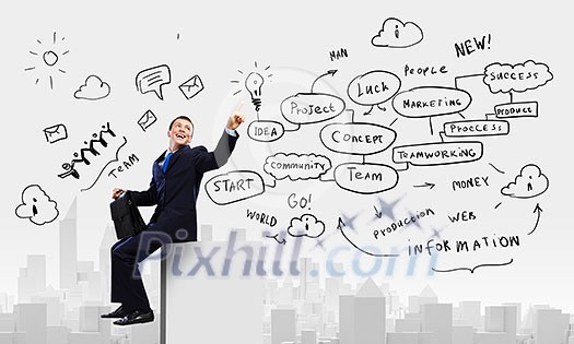 Young businessman with suitcase sitting on roof of building Young businessman with suitcase sitting on roof of building