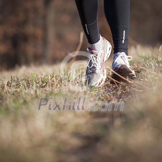 Jogging outdoors in a meadow (shallow dof, focus on the running shoe) Jogging outdoors in a meadow (shallow dof, focus on the running shoe)