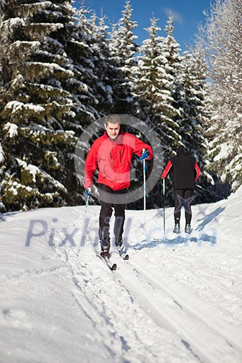 Cross-country skiing: young man cross-country skiing on a lovely sunny winter day Cross-country skiing: young man cross-country skiing on a lovely sunny winter day