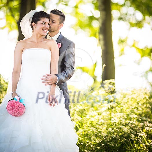 Portrait of a young wedding couple on their wedding day Portrait of a young wedding couple on their wedding day