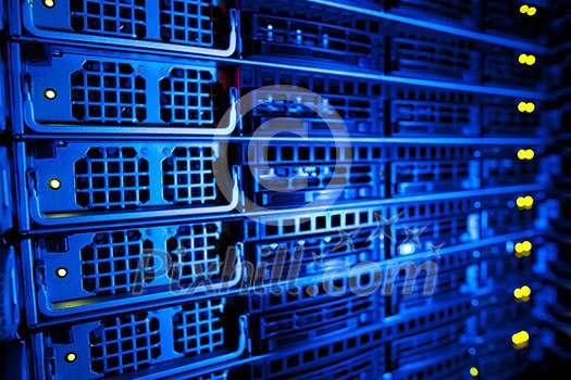 Server rack cluster in a data center (shallow DOF; color toned image) Server rack cluster in a data center (shallow DOF; color toned image)