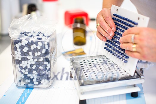 medical pills industry factory and production indoor, worker's hands handling pills medical pills industry factory and production indoor, worker's hands handling pills