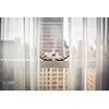 Lovely fashionable shoes of a bride on a window during wedding day preparations
