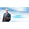 Young handsome businessman holding tablet pc in hand