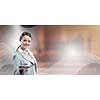 Attractive smiling businesswoman holding tablet pc in hands