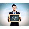 Young businessman holding frame with weather drawings