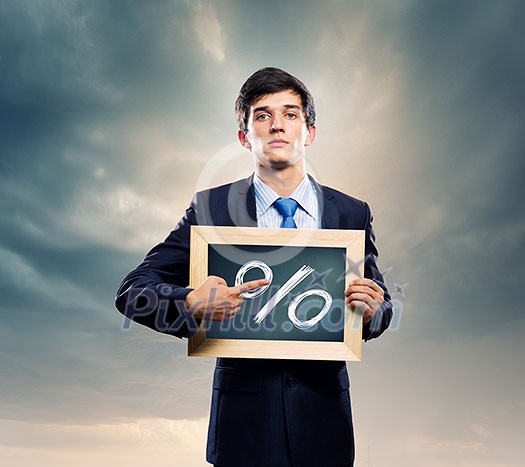 Handsome businessman holding frame with percentage symbol Handsome businessman holding frame with percentage symbol