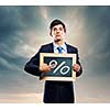 Handsome businessman holding frame with percentage symbol