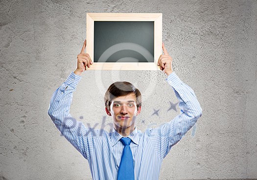 Handsome businessman holding blank frame. Place for text Handsome businessman holding blank frame. Place for text