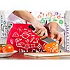 Close up of cook hands cutting vegetables with knife