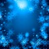 Blue Christmas background with snowflakes and lights