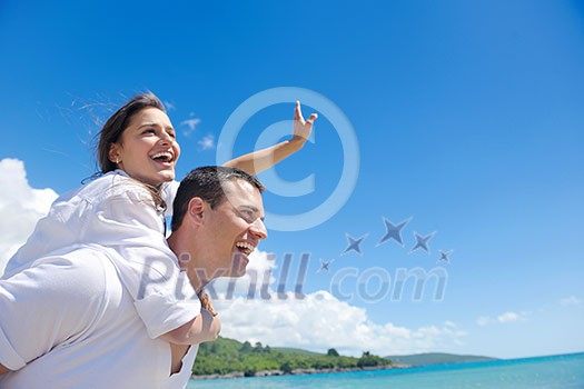 happy young couple have fun and relax on the beach happy young couple have fun and relax on the beach