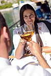happy young couple having lanch at beautiful restaurant on the beach