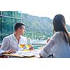 happy young couple having lanch at beautiful restaurant on the beach