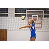 volleyball game sport with group of young beautiful girls indoor in sport arena school gym