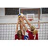 volleyball game sport with group of young beautiful girls indoor in sport arena school gym