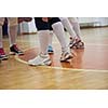 volleyball game sport with group of young beautiful girls indoor in sport arena school gym