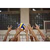 volleyball game sport with group of young beautiful girls indoor in sport arena school gym