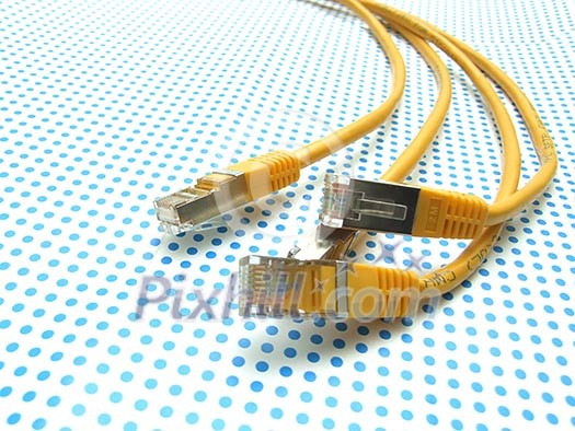 yellow ethernet cable on dotted background yellow ethernet cable on dotted background