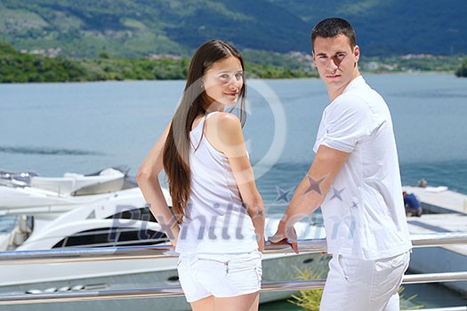 Romantic young couple spending time together and relaxing on yacht Romantic young couple spending time together and relaxing on yacht