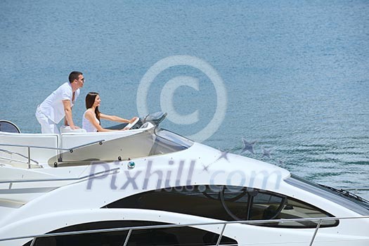 Romantic young couple spending time together and relaxing on yacht Romantic young couple spending time together and relaxing on yacht