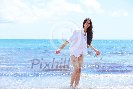 beautifel and happy woman girl on beach have fun and relax on summer vacation over the beautiful tropical sea beautifel and happy woman girl on beach have fun and relax on summer vacation over the beautiful tropical sea