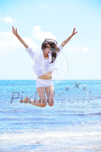 beautifel and happy woman girl on beach have fun and relax on summer vacation over the beautiful tropical sea beautifel and happy woman girl on beach have fun and relax on summer vacation over the beautiful tropical sea