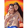happy young couple have fun and relax  on the beach