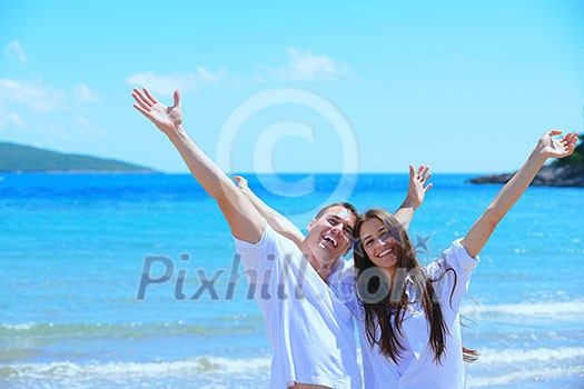 happy young couple have fun and relax on the beach happy young couple have fun and relax on the beach