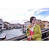 Beautiful tourist woman in Venice, exploring the old city