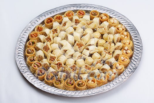 traditional dessert turkish baklava,well known in middle east and delicious isolated on white background traditional dessert turkish baklava,well known in middle east and delicious isolated on white background