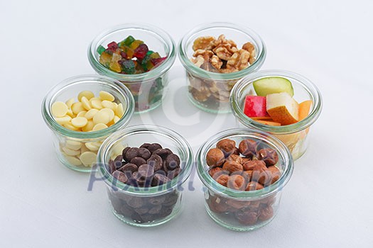 nuts and dry fruits mix healthy organic food mix in glass bowls isolated on white background nuts and dry fruits mix healthy organic food mix in glass bowls isolated on white background