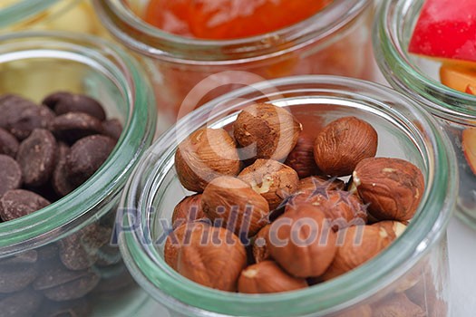 nuts and dry fruits mix healthy organic food mix in glass bowls isolated on white background nuts and dry fruits mix healthy organic food mix in glass bowls isolated on white background
