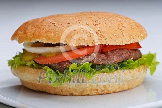 still life with fast food hamburger menu, french fries, soft drink and ketchup still life with fast food hamburger menu, french fries, soft drink and ketchup
