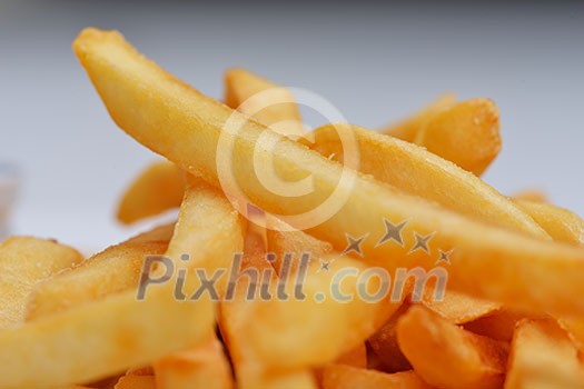 French fries with ketchup over white background French fries with ketchup over white background