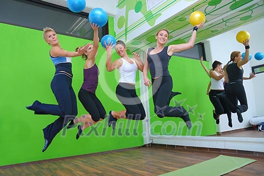 happy girls jumping in fitness centre happy girls jumping in fitness centre