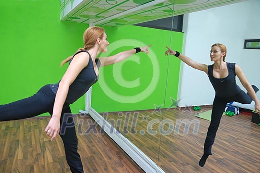 happy girls jumping in fitness centre happy girls jumping in fitness centre