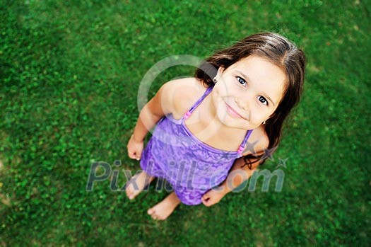 happy young girl children relax lie and have fun on grass with flower happy young girl children relax lie and have fun on grass with flower