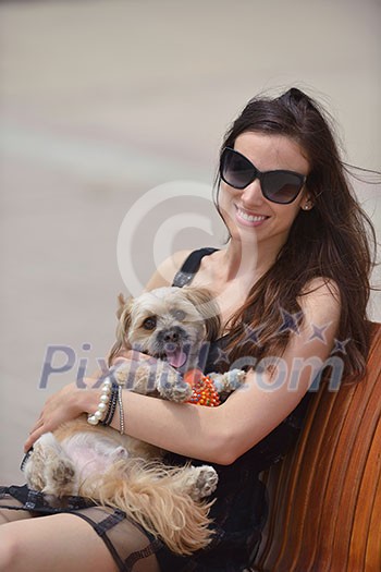 beautiful happy young woman in black dress with cute small dog puppy have fun on street beautiful happy young woman in black dress with cute small dog puppy have fun on street