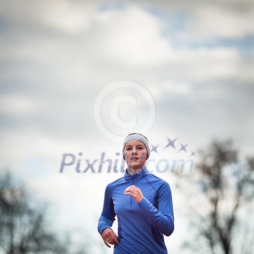 Portrait of a woman running against against blue sky Portrait of a woman running against against blue sky