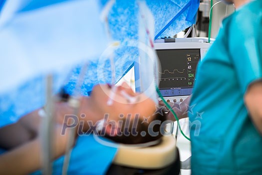 Unidentified boy undergoing a surgery. Focus on the monitor with vital functions Unidentified boy undergoing a surgery. Focus on the monitor with vital functions