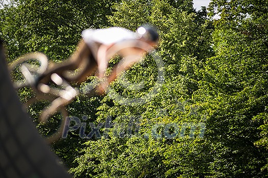 BMX Biker Performing Tricks during ride on a ramp BMX Biker Performing Tricks during ride on a ramp