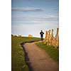 Young woman on her evening jog along the seacoast