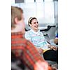 Group of college/university students during a brake between classes - chatting, comparing notes, having fun (shallow DOF; color toned image)