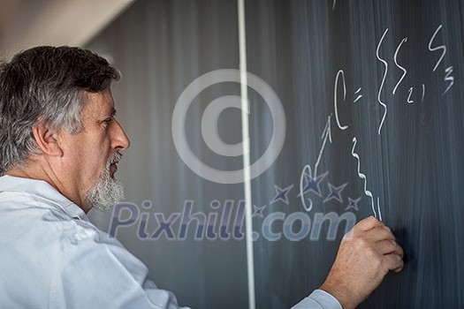 Senior chemistry professor writing on the board while having a chalk and blackboard lecture (shallow DOF; color toned image) Senior chemistry professor writing on the board while having a chalk and blackboard lecture (shallow DOF; color toned image)
