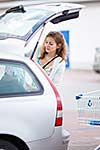 Beautiful young woman going shopping for groceries (color toned image)