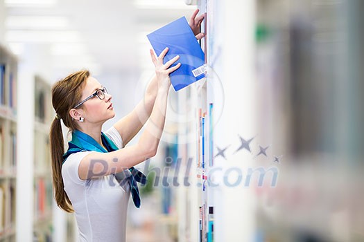 Pretty, female college student in a library, looking for a book (shallow DOF; color toned image) Pretty, female college student in a library, looking for a book (shallow DOF; color toned image)